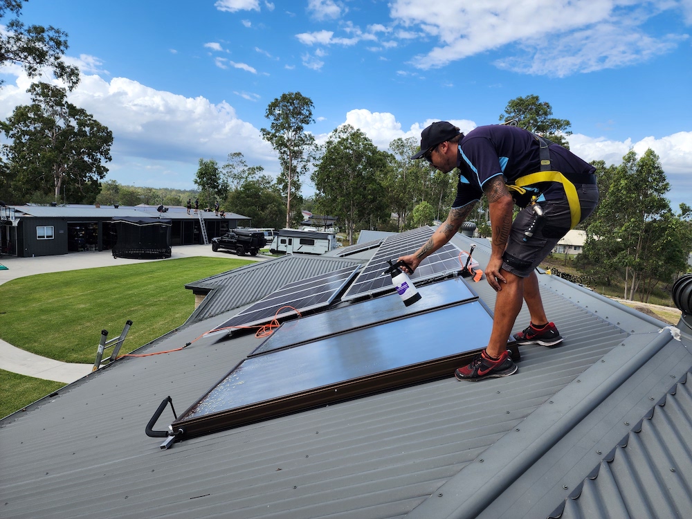 solar panel cleaning team member